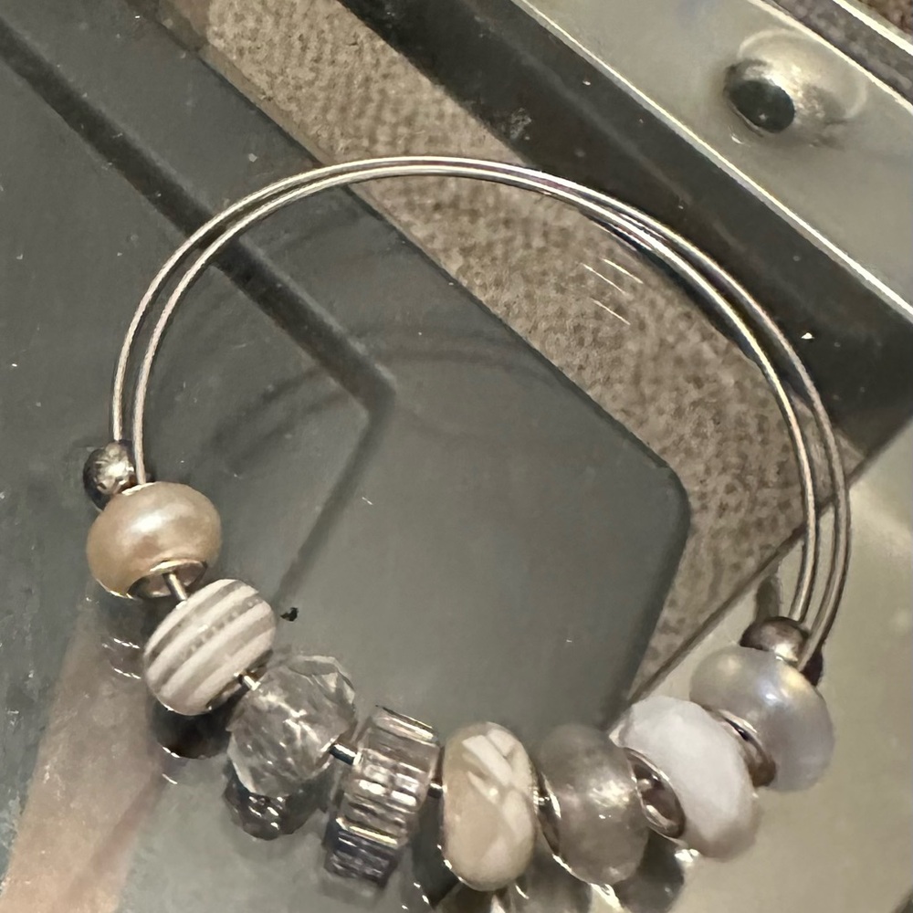 Silver bracelet with charms